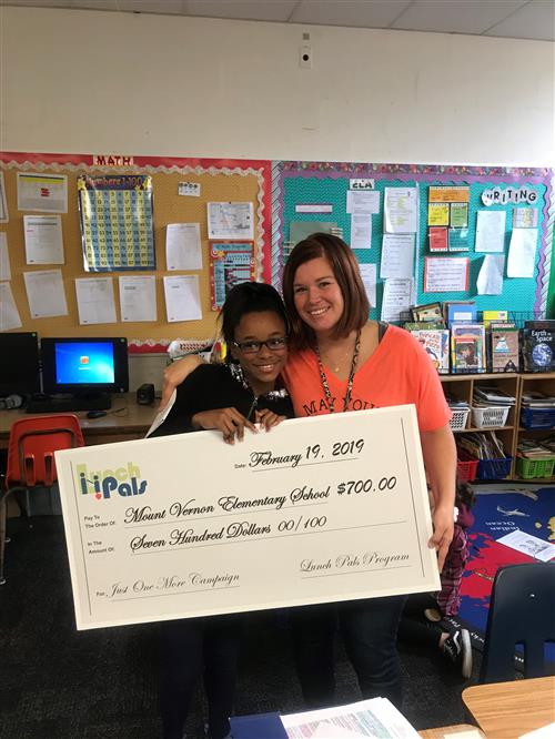 Student with Mount Vernon Elementary student and Lunch Pals check. 